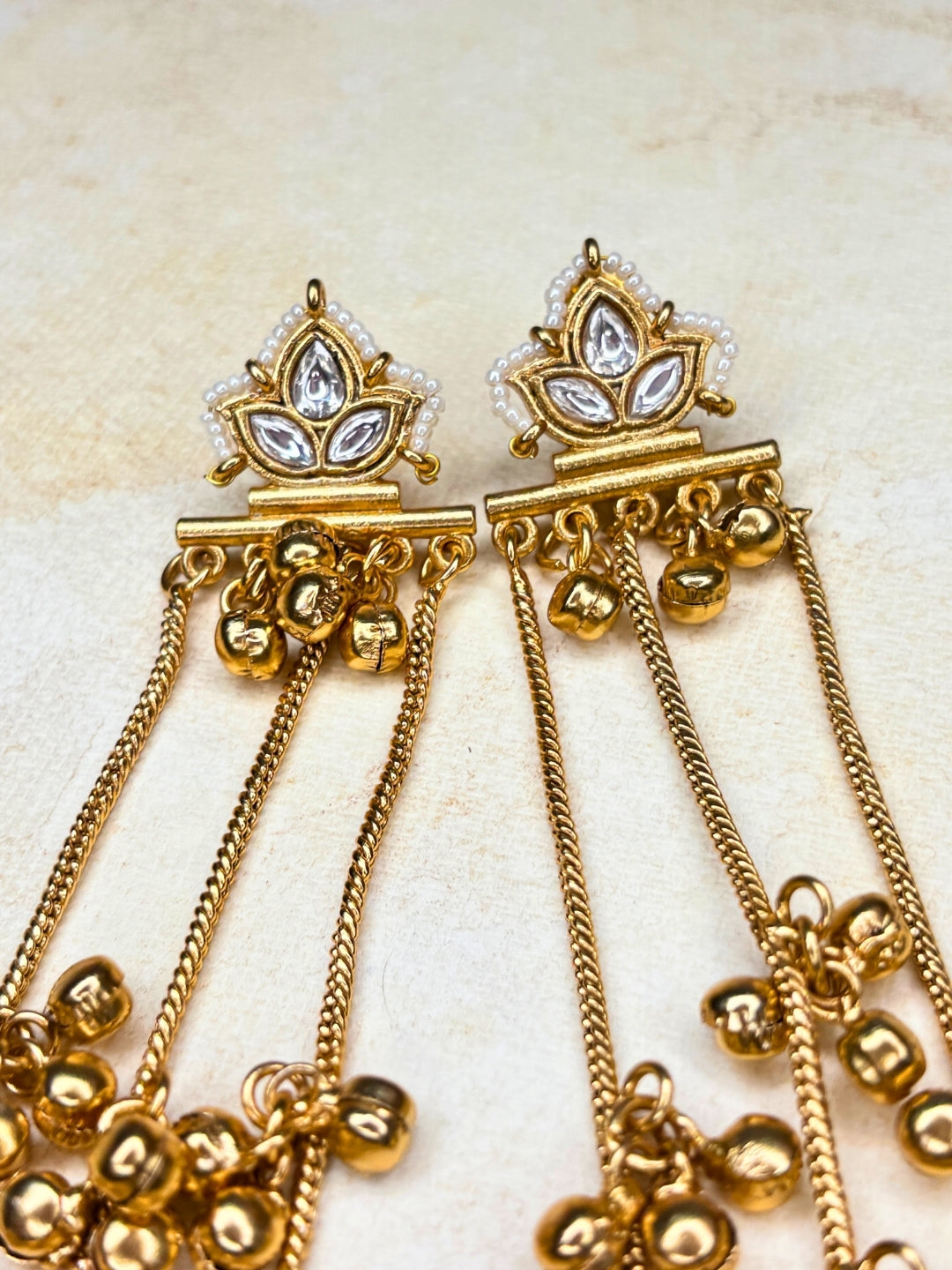 Gold-Plated White Stone Ghungroo Chain Dangler Statement Earrings